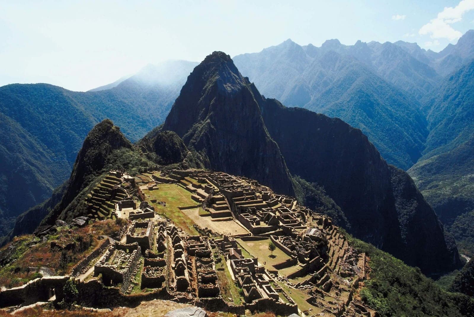 Machu Picchu ruins with steep Andes peaks in the background